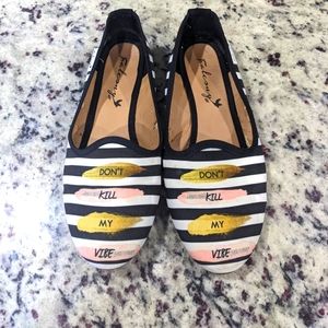 Black and white striped flats